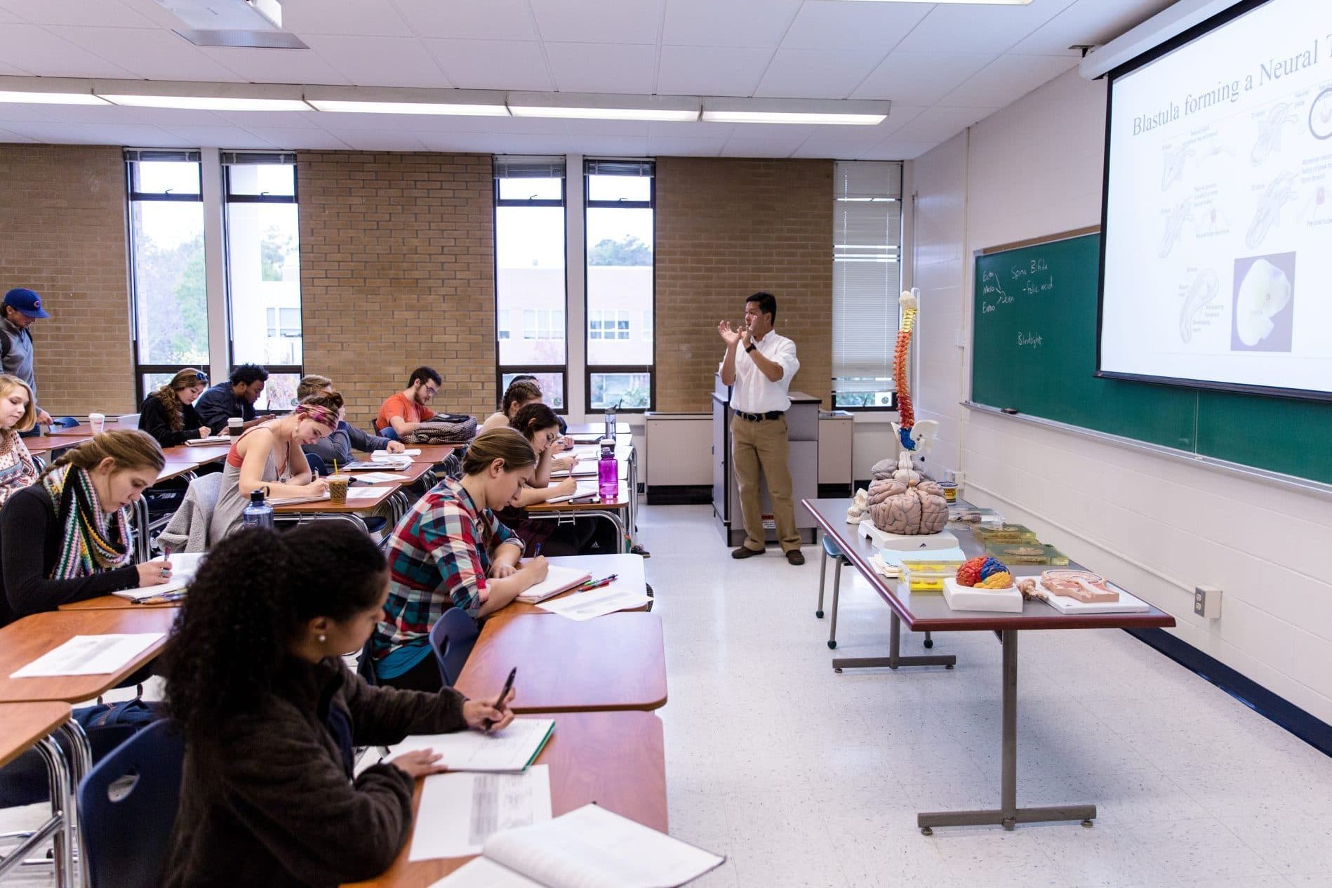 Teachers and students interacting in classroom